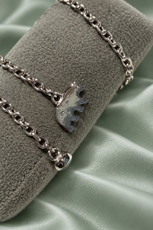 Close-up of Unbroken sterling silver bracelet and adjustable closure